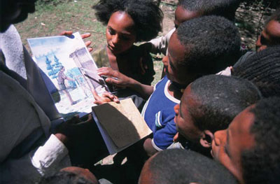 Children with hygiene education cards