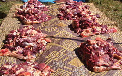 Raw meat being prepared