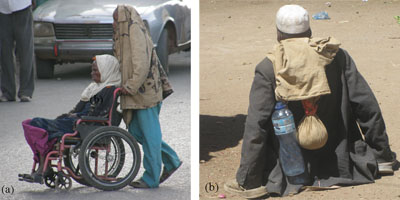 Man and woman with a physical impairment, however the woman has a wheelchair