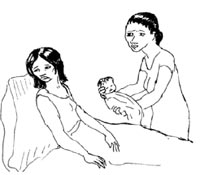 A mother is sitting up in bed. A health professional offers the mother her baby and she looks away.