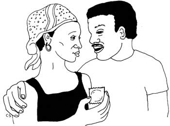 A woman talking with her partner and holding a condom.